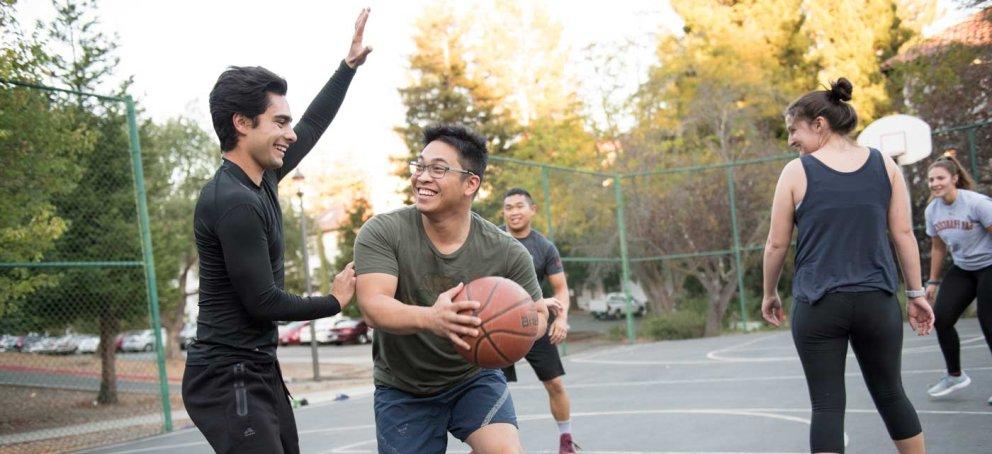 Transfer students playing basketball